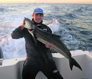 The author with a cobia caught on an Atomic plastic while float-lining for snapper.