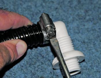 Attach your spiral bilge hose to the skin fitting and then secure with a stainless steel hose clamp.