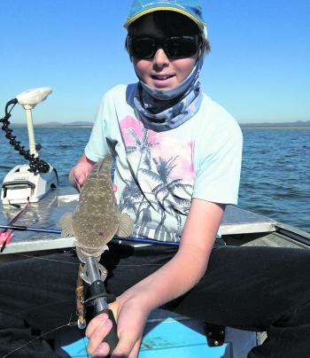 Brendan Reed with a little creek flathead caught on a small minnow lure.