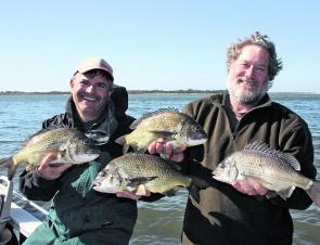 Max Suthern and Saint with a brace of 40cm-plus bream, released after the photo