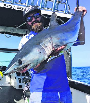 Jules Frank with a nice little mako taken while fishing out through the heads.