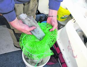 Place all of the calamari into the keeper bag which has been inserted into the scaler bag.