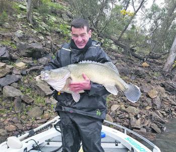 Jason Swan craddles his amazing plus sized Murray cod.