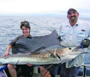Kerry Huxford of New Zealand with Rob Smithh and a Mooloolaba sailfish caught while on charter with Rob aboard Triton IV during April.