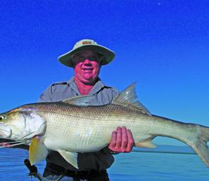 Brian Heffer with a decent 1m threadfin just before cyclone Yasi. 