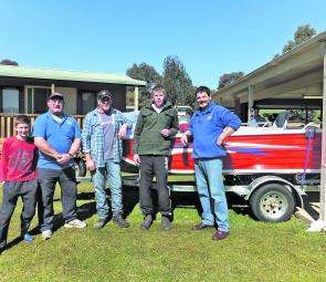 The top prize at the Grabine Classic, the Brooker boat and Mercury outboard went to Luke Charnock of Goulburn. At the presentation are, from left, Sam Cramp, committee man Phil Cramp, Jodie Charnock, Luke Charnock and president Kim George.