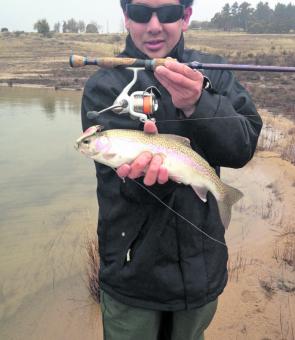 Lachie Ma with his first trout on a hardbody lure. Saltwater or fresh, the basics remain the same.