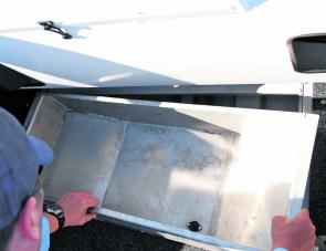 The fish holding well or kill well at the stern end is removable and also has a drain plug that empties into the bilge area. Simple and effective.