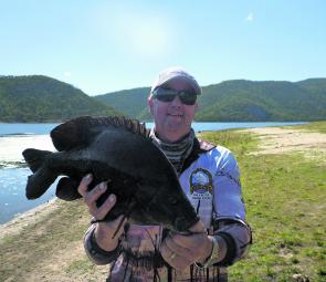 Mackay Tournament Anglers Geoff Newby caught this 53cm sooty slowly working a small vibe up between the twin trunks of a submerged tree in Eungella Dam.