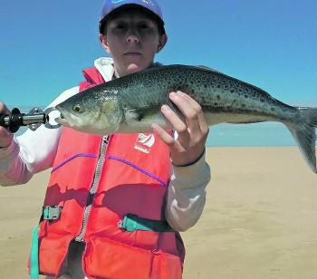 Seth Steed fishing from his kayak bagged a 59cm salmon on a metal lure.