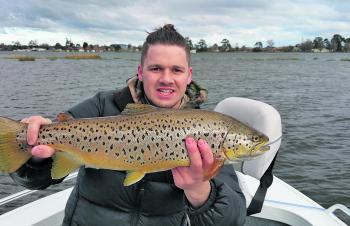 Tom Jarman with a magnificent Lake Wendouree brown trout caught fly fishing