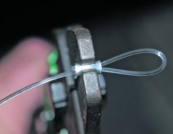 When crimping lighter mono and fluoro from around 40lb to 150lb, use a small aluminium crimp like this. The crimp is oval and should be placed sideways in the tool. Place the plier in the centre, choose the correct hole on swaging tool and squeeze the han