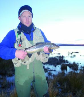Adam Scurrah with a Little Pine trout taken from the extreme shallows.