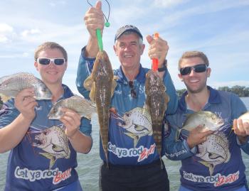 Casey, Trevor and Ryan show off some of the mixed fish you can catch on soft vibes.