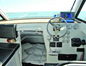 The JayCat's helm set up is ideal, everything is within sight and easy reach. The starboard passenger's seat has a big icebox below to complement the skipper's under seat fridge.