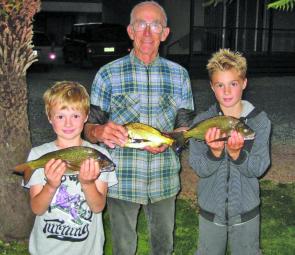 John Murfett with his grandsons, Tom and Jack with their bream, which they caught in the lake on prawn.