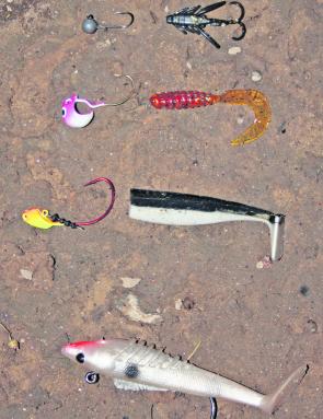 A range of soft plastics. From the top, A black 1” Strike Tiger nymph with a small Squidgy jig head, an ideal rig for trout. Second from the top, A red Damiki curl tail grub with a vibrantly coloured Knuckleball jighead, a great rig for redfin. Third from