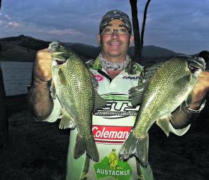 Dave from Orange at St Clair with a couple of bass caught after dark.