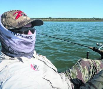 Trolling a drop off with the rod secured in the Railblaza rod holder.