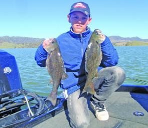 Luke Draper of Singleton with Glenbawn bass of 42cm and 46cm caught on ice jigs on a perfect clear day.