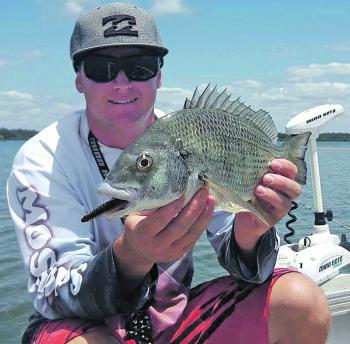 Wazza Schmidt with a monster of a Moreton Bay bream. Check out the lips! This fish took a liking to a surface stickbait.