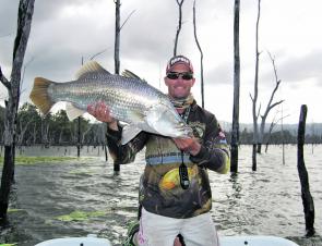 Matt McArthur with one of the many beautifully coloured barra taken from Teemburra in the first round.